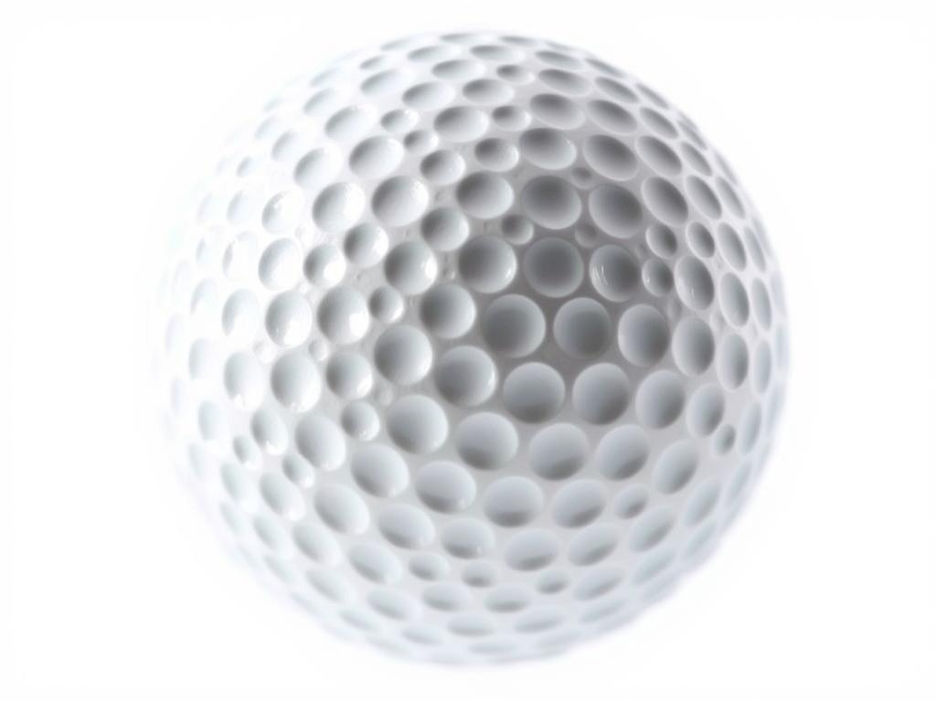 Close-up of a golf ball showing its dimples for a numerical estimation tie break question Close-up of a golf ball showing its dimples for a numerical estimation tie break question